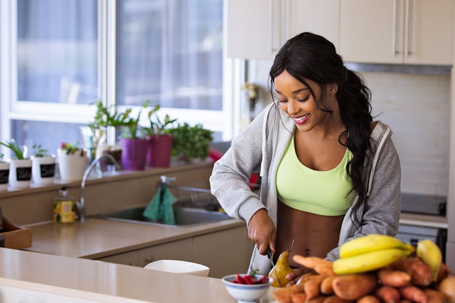 Woman enjoying a healthy morning in a bright kitchen